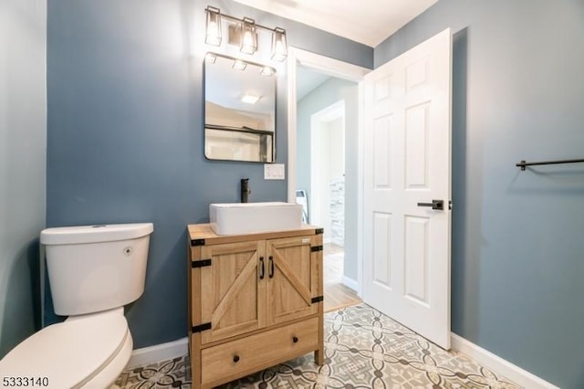 bathroom featuring toilet and vanity