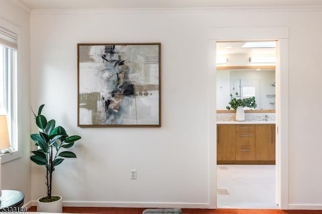 interior space with a wall unit AC and crown molding