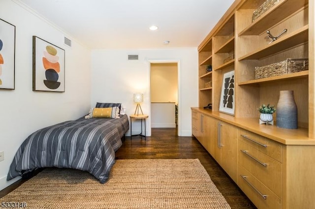 bedroom featuring dark hardwood / wood-style flooring and ornamental molding