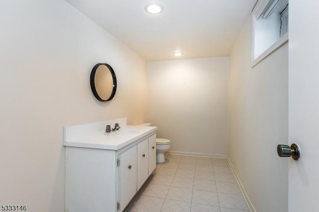 bathroom featuring toilet and vanity