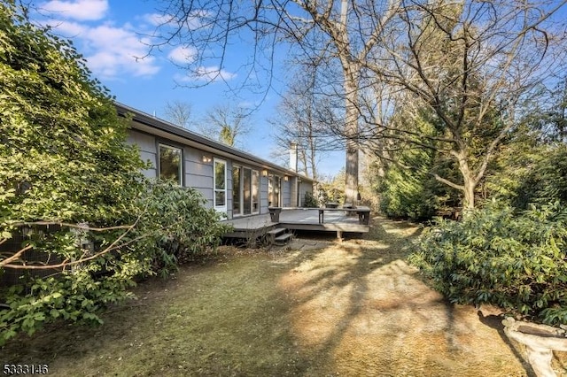 view of yard featuring a deck