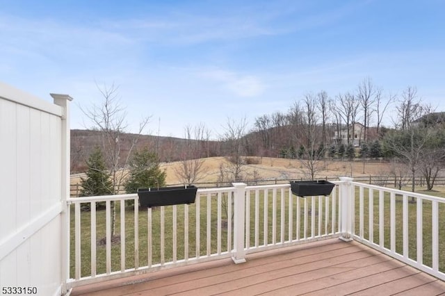 wooden terrace with a yard