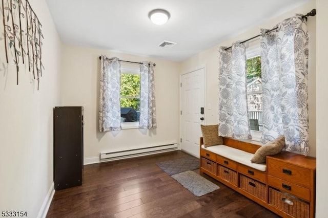 sitting room with dark hardwood / wood-style floors and a baseboard radiator