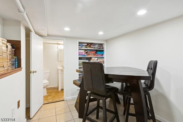 dining room with light tile patterned flooring