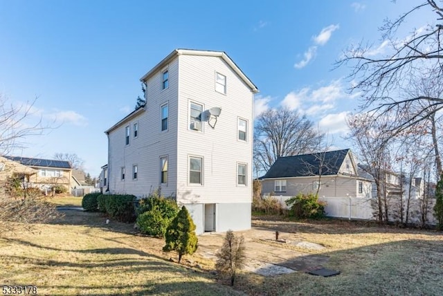 view of side of property featuring a yard