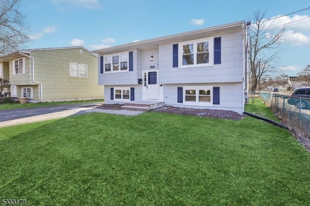 raised ranch featuring a front yard