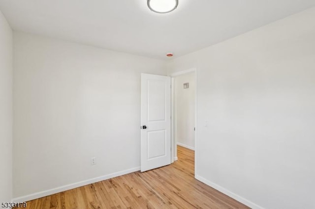 unfurnished room featuring light hardwood / wood-style floors