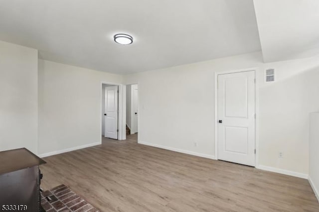 unfurnished room with light hardwood / wood-style floors