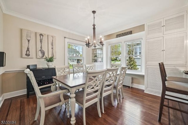 dining room featuring baseboards, an inviting chandelier, ornamental molding, and radiator heating unit