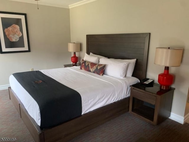 carpeted bedroom featuring crown molding