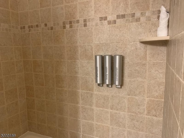 bathroom with a tile shower