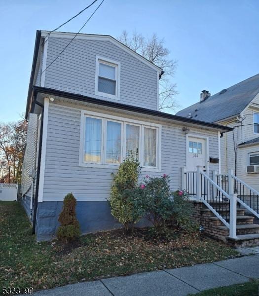 view of front of property featuring cooling unit