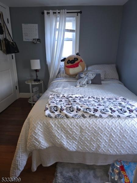 bedroom featuring dark hardwood / wood-style flooring