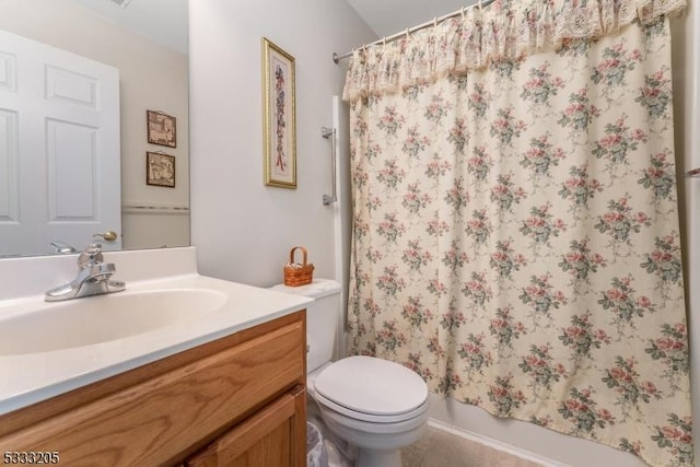 bathroom featuring toilet and vanity