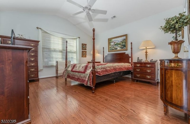 bedroom featuring vaulted ceiling, ceiling fan, and hardwood / wood-style flooring