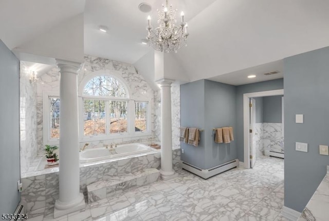 bathroom with a baseboard radiator, tiled tub, ornate columns, and a notable chandelier