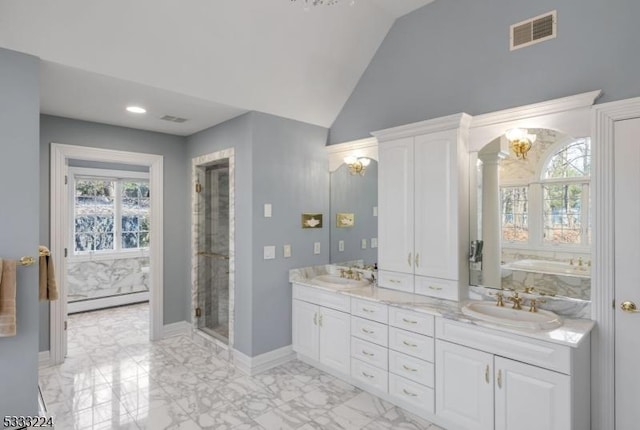 bathroom with baseboard heating, lofted ceiling, vanity, ornate columns, and a tub