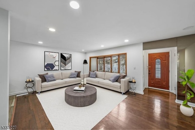 living room with dark hardwood / wood-style floors