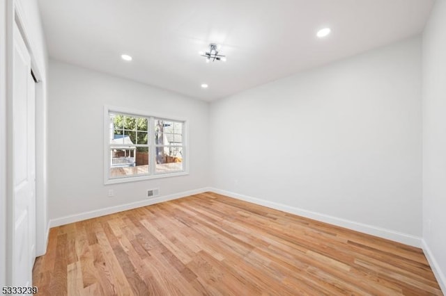 unfurnished room featuring light hardwood / wood-style floors