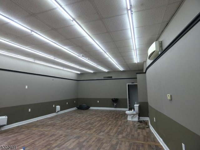 basement with hardwood / wood-style floors