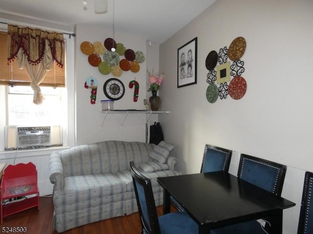 dining area with dark wood-type flooring and cooling unit