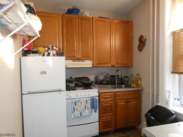 kitchen featuring sink and white appliances