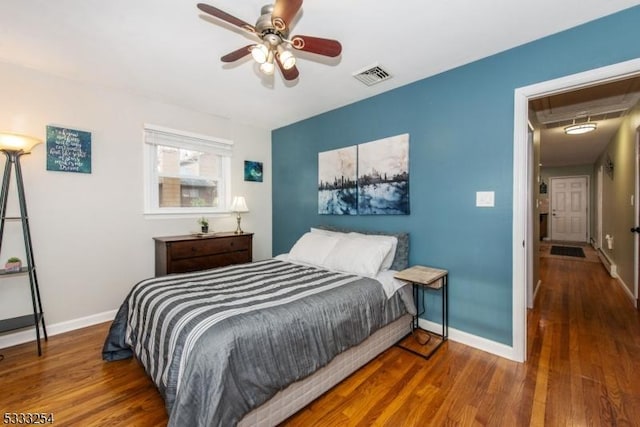 bedroom featuring dark wood-type flooring and ceiling fan