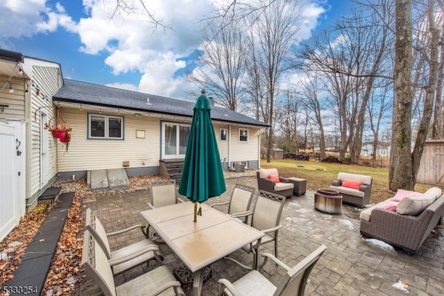 view of patio / terrace featuring an outdoor living space with a fire pit