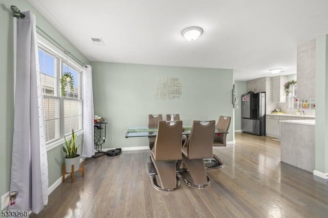 dining area with light hardwood / wood-style floors