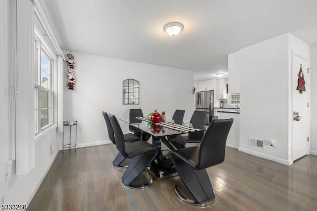 dining room featuring dark wood-type flooring