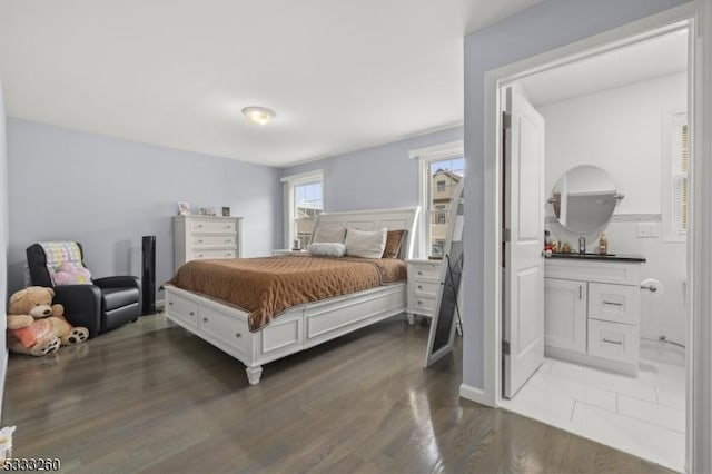 bedroom with dark hardwood / wood-style flooring