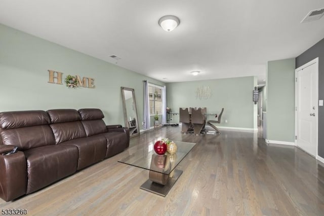 living room with light hardwood / wood-style flooring