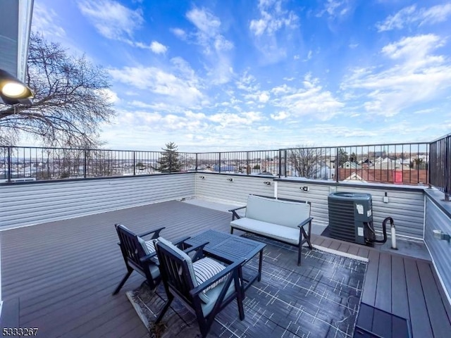 deck featuring an outdoor hangout area and central AC