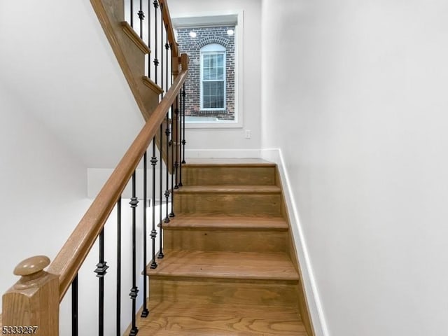 stairs with wood-type flooring