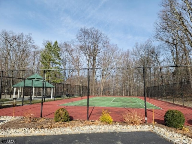 view of tennis court featuring a gazebo