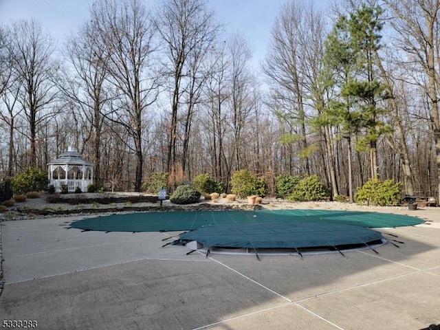 view of swimming pool featuring a gazebo