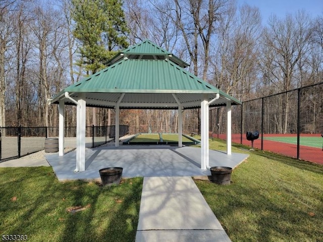 view of property's community with a gazebo and a yard