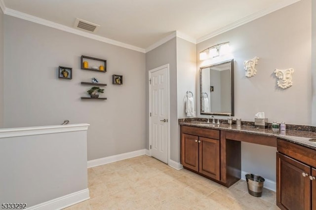 bathroom with tile patterned flooring, crown molding, and vanity