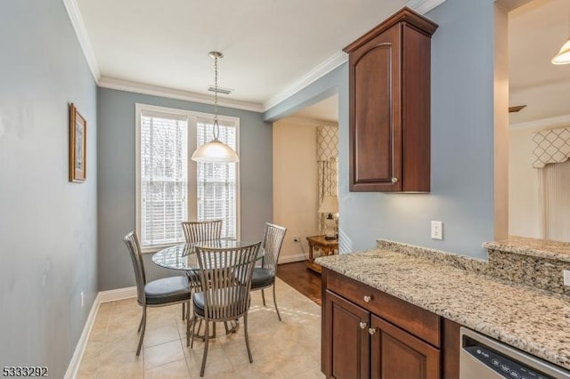 tiled dining room featuring ornamental molding