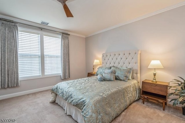 bedroom featuring ceiling fan, crown molding, multiple windows, and carpet flooring