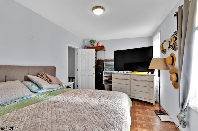 bedroom featuring light parquet floors