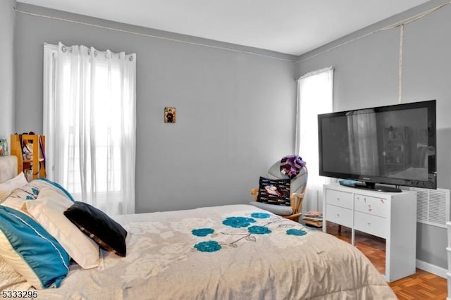 bedroom featuring parquet floors