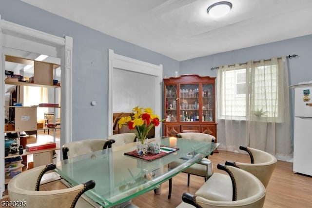 dining space featuring light hardwood / wood-style floors