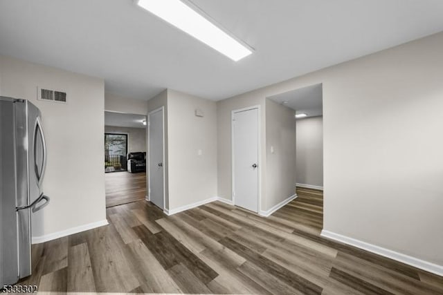 unfurnished room featuring wood-type flooring