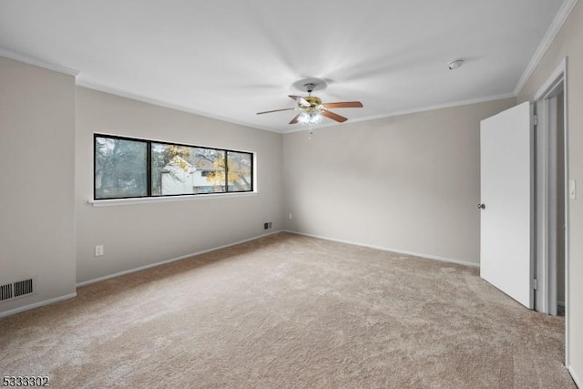 unfurnished bedroom featuring light carpet, ornamental molding, and ceiling fan