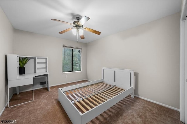 unfurnished bedroom with carpet flooring, ceiling fan, and a closet