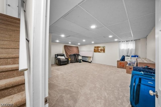 playroom with a paneled ceiling and carpet flooring