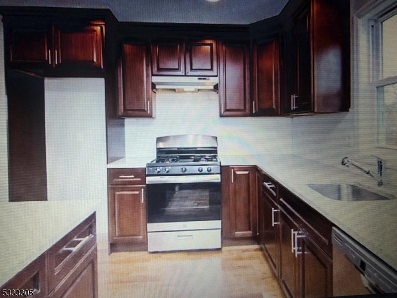 kitchen with sink, dishwasher, gas range, and tasteful backsplash