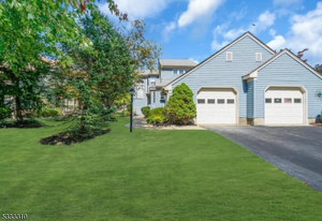 view of front facade featuring a front lawn and a garage