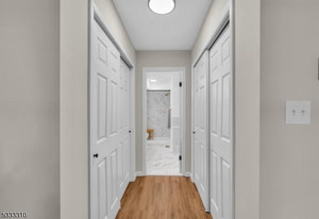 hallway featuring light wood-type flooring